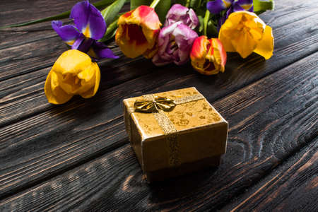 Tulip and gift boxes on wood backgroundの写真素材