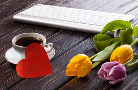 Tulip and red heart on wood backgroundの写真素材