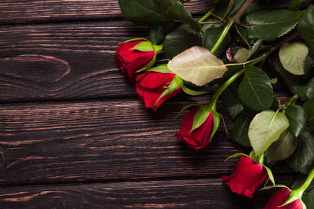 Beautiful bouquet of roses on table close-upの写真素材