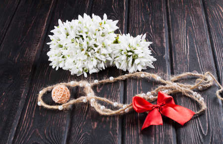 snowdrops bunch on wooden backgroundの写真素材