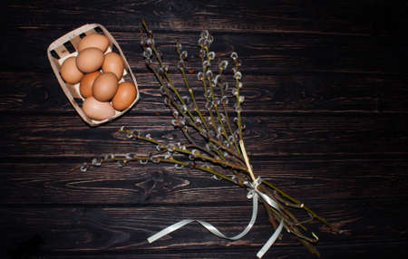 Easter eggs and young willow branchesの写真素材