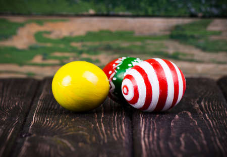 Easter eggs on wooden backgroundの写真素材