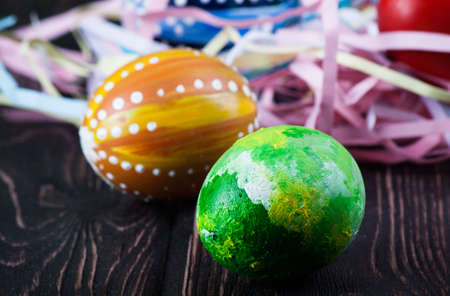Easter eggs on wooden backgroundの写真素材