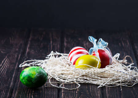 Easter eggs on wooden backgroundの写真素材