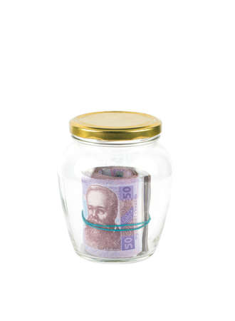 Glass bank for tips with money and hand isolated on white. Ukrainian money