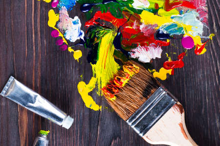 Paint spots on a wooden board. Celebrate festival holiday. Indian holiday festival of colors