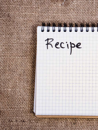 blank recipe book on sackclothの写真素材