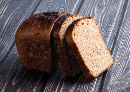 whole grain bread isolated on wood desk