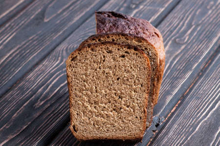 whole grain bread isolated on wood desk