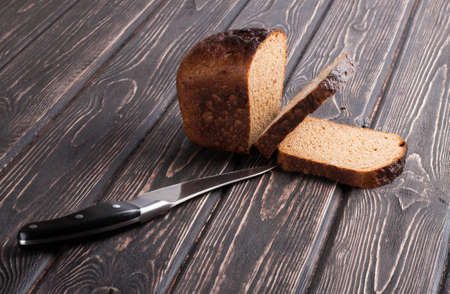 whole grain bread isolated on wood desk