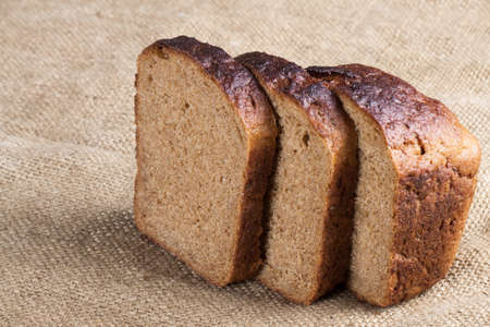 whole grain bread isolated on sack cloth