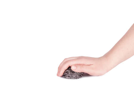 female hand holding a scraper for washing dishesの写真素材