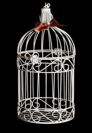 Shabby chic bird cage isolated on black backgroundの写真素材