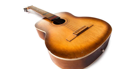 Old guitar on a white background. Classical Guitar