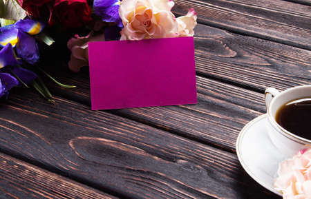 Cup of coffee with flowers on the tableの写真素材