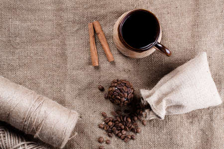 Cup of coffee on sacking. Roasted coffeeの写真素材
