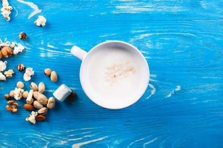 Latte coffee in cup on wood desk.の写真素材