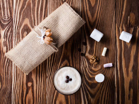 Latte coffee in cup on wood desk.の写真素材