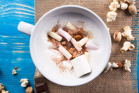 Latte coffee in cup on wood desk.の写真素材