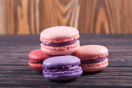 Multicolored macaroon on brown boards. Bakery products. Dessertの写真素材