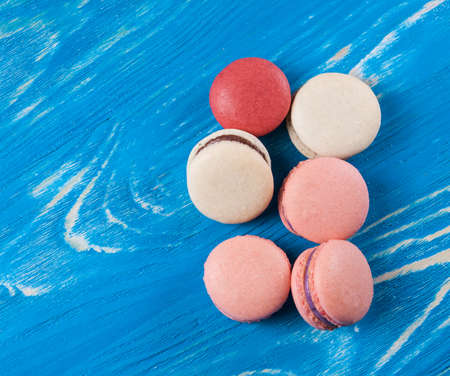 Multicolored macaroon on blue board