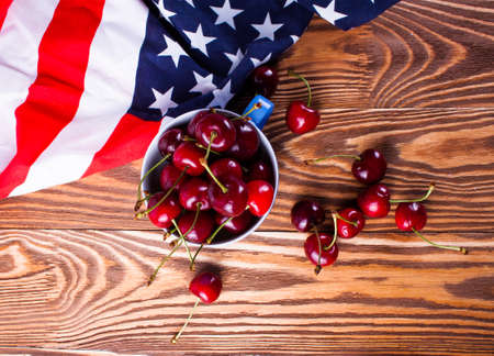 Cherry isolated on wood desk. Fresh cherryの写真素材