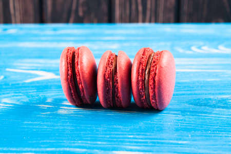 Multicolored macaroon on brown boards. Bakery products. Dessertの写真素材