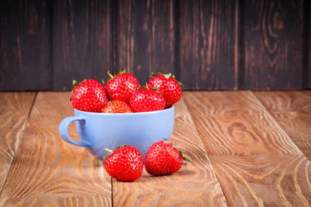 Ripe fresh strawberry on a wood desk. Nature backgroundの写真素材