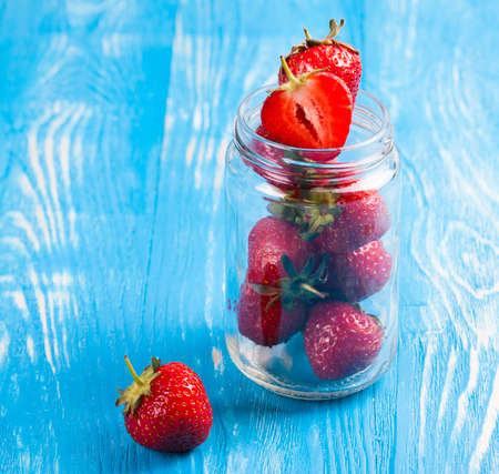 Ripe fresh strawberry on a wood desk. Nature backgroundの写真素材