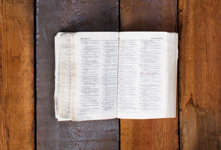 Open Bible on wooden boardの写真素材