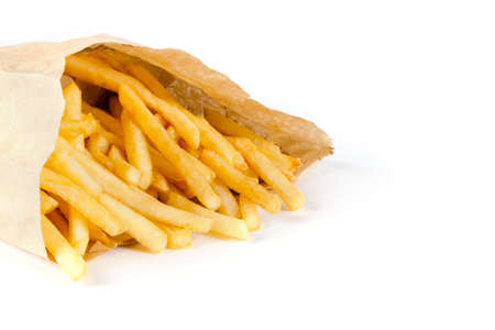pile of appetizing french fries on a white background