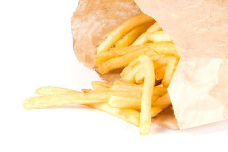 pile of appetizing french fries on a white background