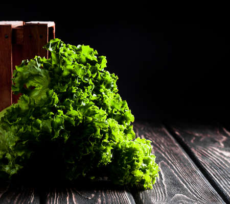 Salad leaf. Lettuce on wood board