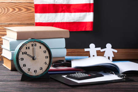 School board and stationery on wooden table. School conceptの写真素材