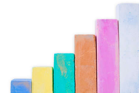 Colorful chalk on a white background. Materials for creativity
