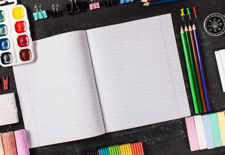 Stationery on a black background with space for text. Education. Back to school