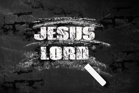 Blackboard with white chalk and an inscription Jesus Lord. painted board