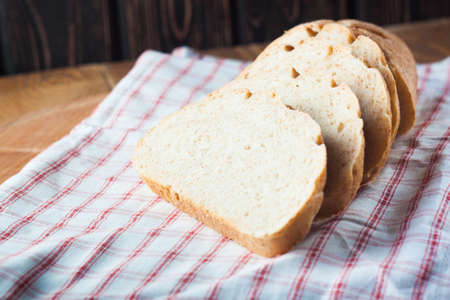 loaf of bread on the wood boardsの写真素材