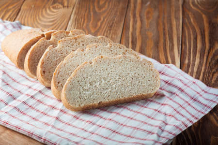 loaf of bread on the wood boardsの写真素材