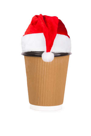 disposable cup in santa hat  of coffee isolated on white backgroundの写真素材