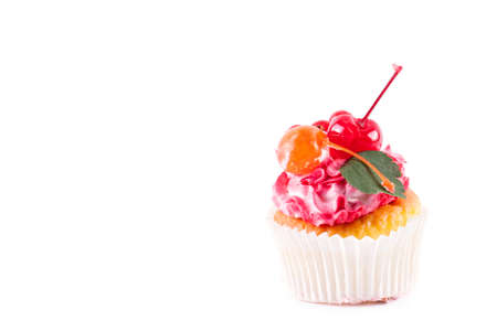 Cake decorated with cream and fresh fruit isolated on white backgroundの写真素材