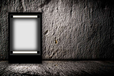 Blank billboard in empty dark room. 3D illustrationの写真素材