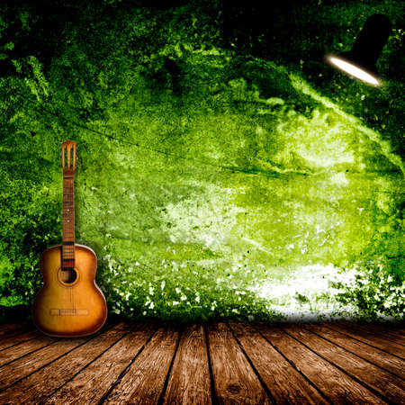 Guitar in the interior of a vintage concert hallの写真素材