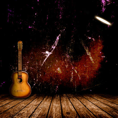 Guitar in the interior of a vintage concert hallの写真素材
