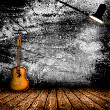 Guitar in the interior of a vintage concert hallの写真素材
