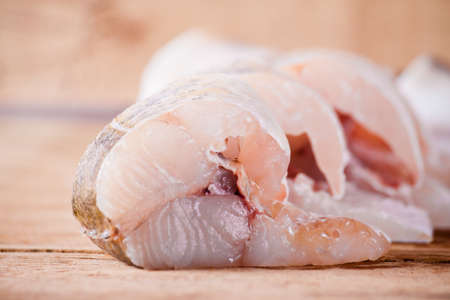 Fillet of pike close up on wood desk.の写真素材