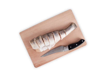 Fresh pike on a wooden chopping board isolated on white backgroundの写真素材