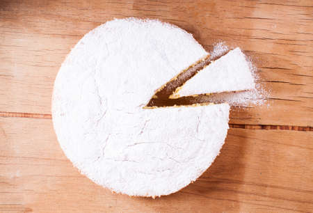 Sponge cake on wood board isolated on white backgroundの写真素材