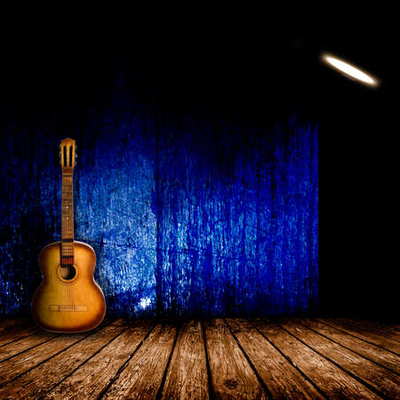 Guitar in the interior of a vintage concert hallの写真素材