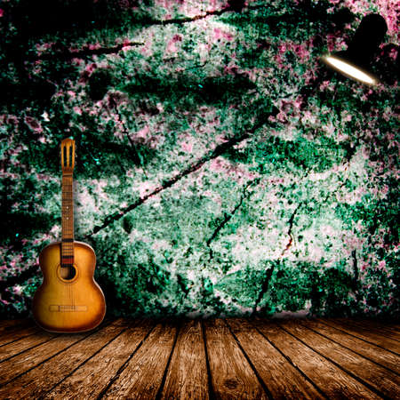 Guitar in the interior of a vintage concert hallの写真素材